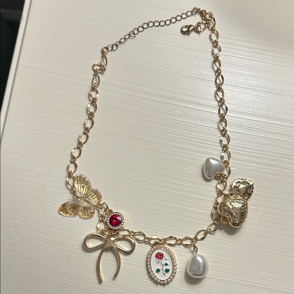 Gold Charm Necklace with Red and Pearl Accents